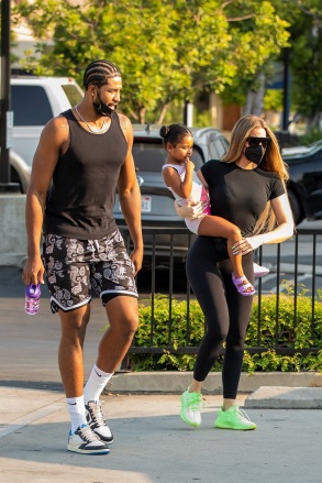 Calabasas, CA  - EXCLUSIVE  - Tristen Thompson was seen showing Khloe Kardashian some love as the co-parents arrived to watch their daughter True at dance class, as he placed his arm around her for a hug. While Khloe and Tristen are kind and affectionate to each other, they probably aren