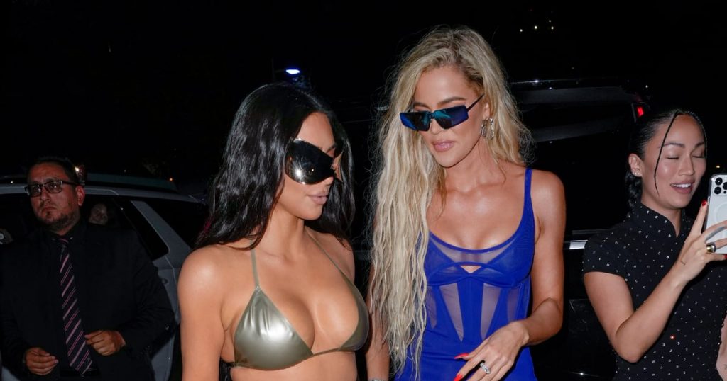 Kim and Khloe Kardashian Cosplay Futuristic Barbies in Matching Silver Swimsuits Kim and Khloe Kardashian Cosplay Futuristic Barbies in Matching Silver Swimsuits