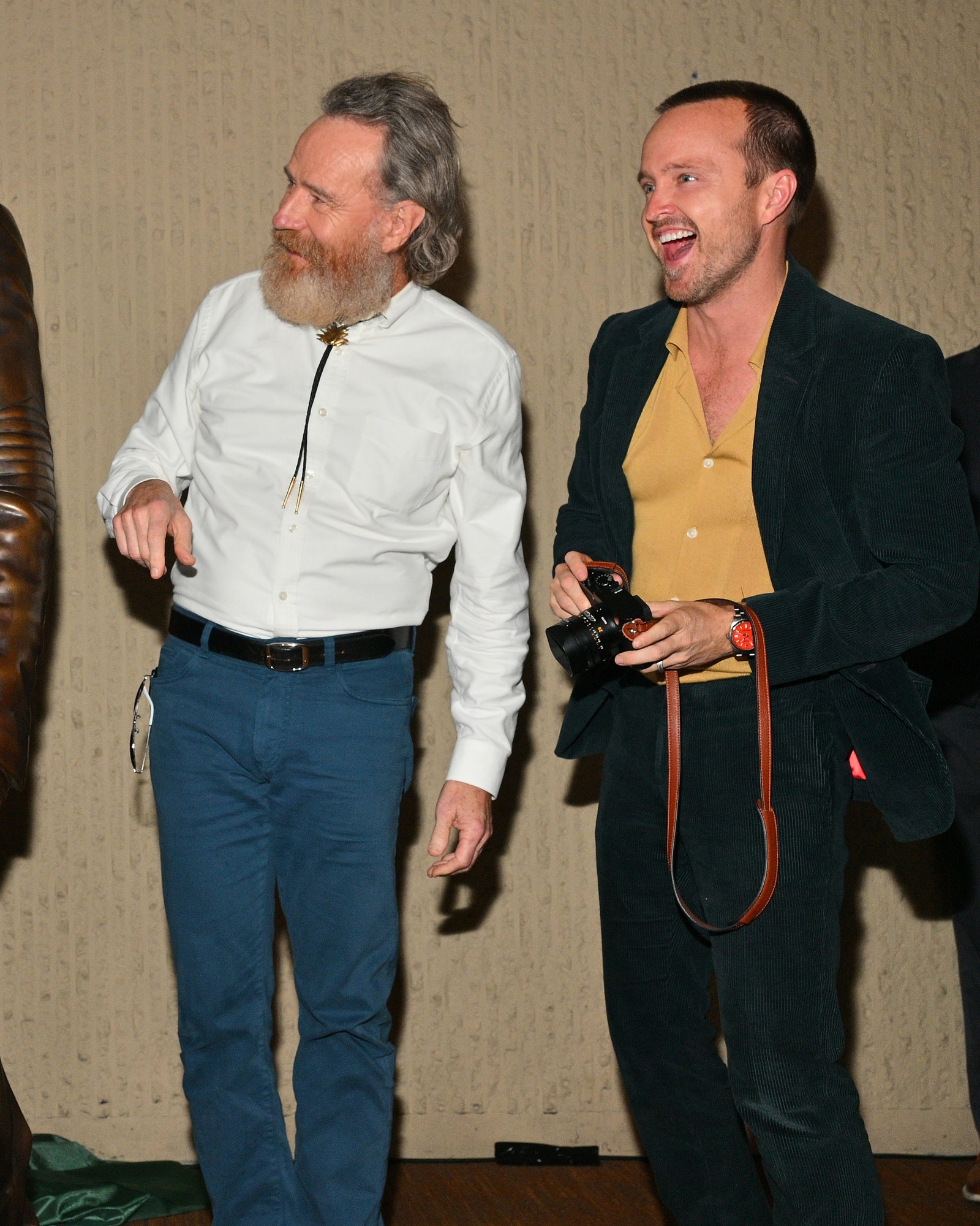 Actor Bryan Cranston  and actor Aaron Paul react after unveiling bronze statues depicting television characters Walter...