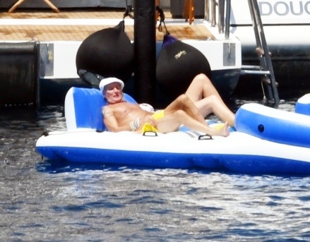 Elba, ITALY  - *EXCLUSIVE*  - Sir Rod Stewart, 77, and wife Penny Lancaster, 51, enjoy the Tuscan Sun while vacationing on Elba Island.   Rod has been enjoying his vacation with wife of 15 years, Penny and their son. Rod still very much a gentleman, was seen extending his hand to Penny to help her as she climbed up the ladder after a dip in the sea.  On Monday the superstar shared a family photo with 7 of his 8 children. The Downtown Train singer was spotted relaxing while enjoying a day aboard the St. David on the Mediterranean. The super yacht comes with every luxury amenity including fully equipped gym, jacquzzi, and tons of toys at the ready including wave runners, sea bobs, wakeboards, kayaks and of course an large inflatable raft which Rod seemed to enjoy quite a bit!  Pictured: Rod Stewart, Penny Lancaster   BACKGRID USA 4 AUGUST 2022   USA: +1 310 798 9111 / usasales@backgrid.com  UK: +44 208 344 2007 / uksales@backgrid.com  *UK Clients - Pictures Containing Children Please Pixelate Face Prior To Publication*