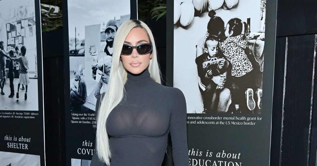 Kim Kardashian Styles a Gray Turtleneck Dress With Shield Sunglasses and Neon Boots Kim Kardashian Styles a Gray Turtleneck Dress With Shield Sunglasses and Neon Boots