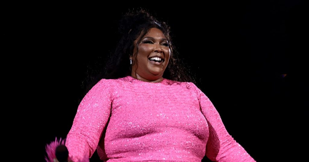 Lizzo Pairs a Hot-Pink Thong Bikini With Chanel Fishnets Lizzo Pairs a Hot-Pink Thong Bikini With Chanel Fishnets