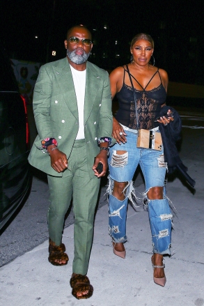 Miami, FL  - EXCLUSIVE  - NeNe Leakes and her boyfriend Nyonisela Sioh were seen arriving at Bar One restaurant for a dinner in Miami, Florida. NeNe looks casually chic in a lace body suit and baggy ripped jeans paired with heels.  Pictured: NeNe Leakes, Nyonisela Sioh  BACKGRID USA 9 MAY 2022   USA: +1 310 798 9111 / usasales@backgrid.com  UK: +44 208 344 2007 / uksales@backgrid.com  UK Clients - Pictures Containing Children Please Pixelate Face Prior To Publication