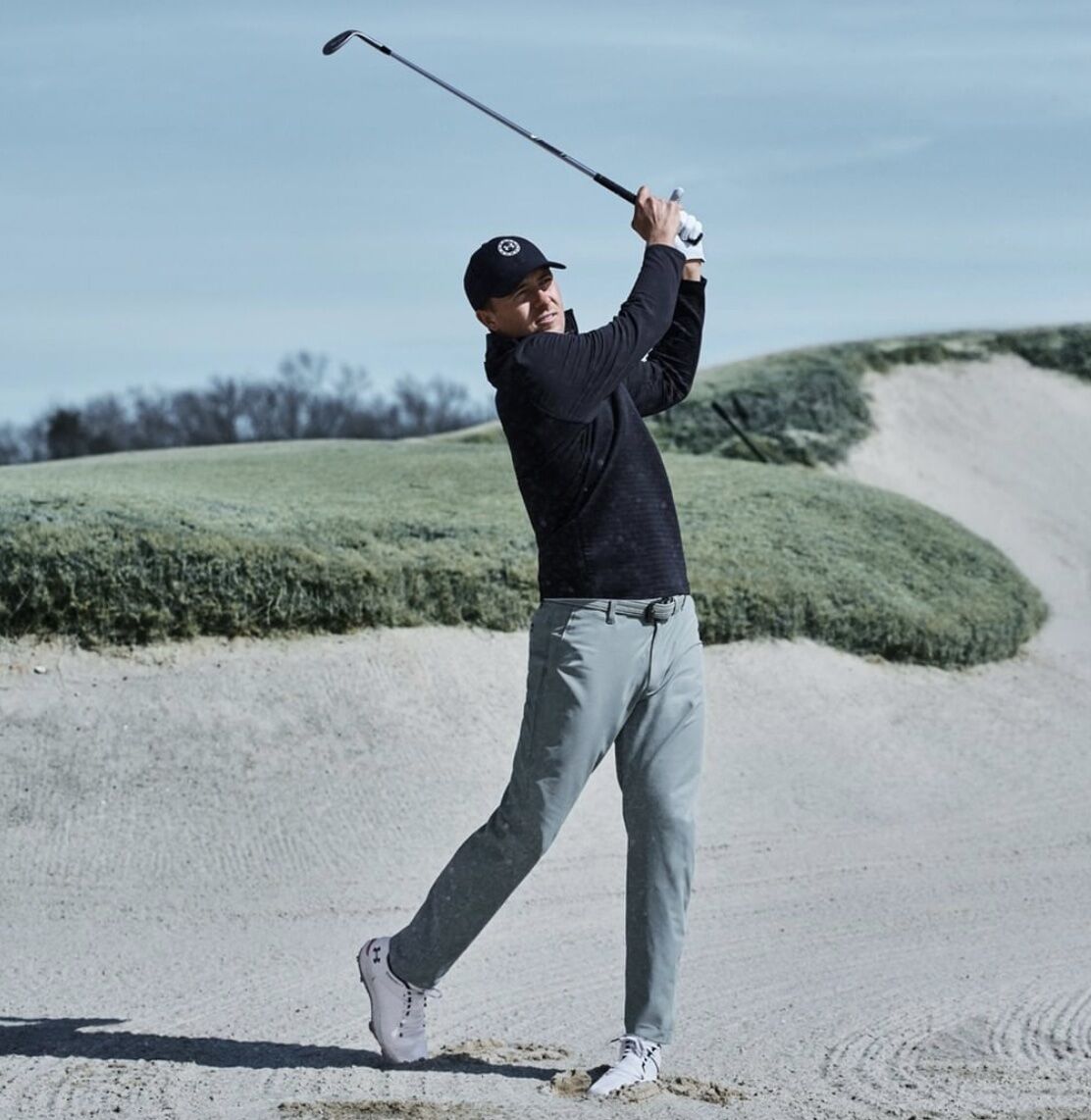Man swinging a golf club